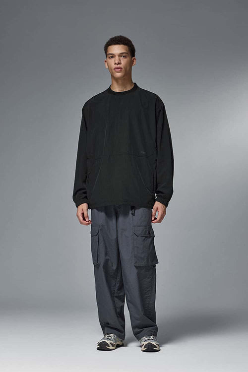 Utility Pocket Nylon Long-Sleeve Pullover in Black - full-length front modeled view