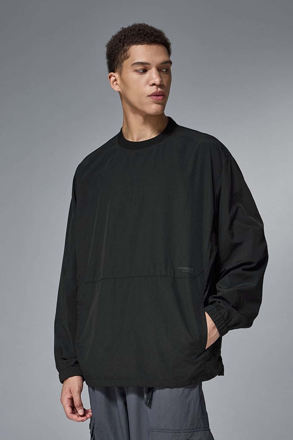 Utility Pocket Nylon Long-Sleeve Pullover in Black - pocket detail