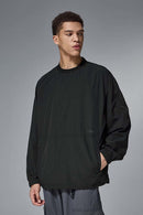 Utility Pocket Nylon Long-Sleeve Pullover in Black - pocket detail