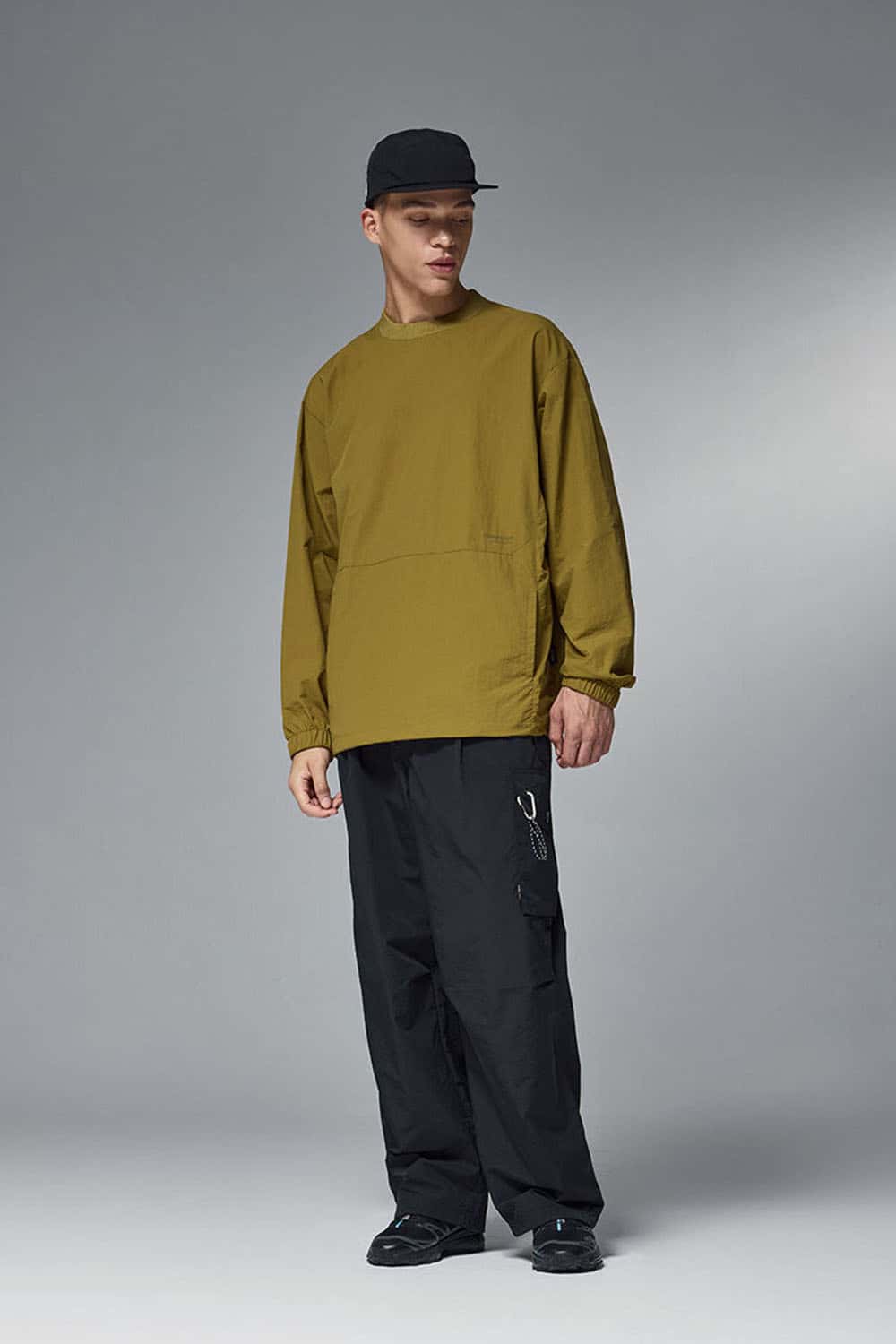 Utility Pocket Nylon Long-Sleeve Pullover in Green - full-length front modeled view