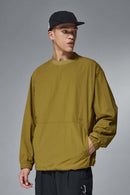 Utility Pocket Nylon Long-Sleeve Pullover in Green - front modeled close-up