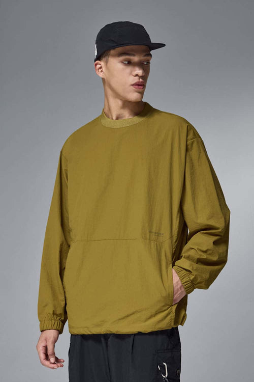 Utility Pocket Nylon Long-Sleeve Pullover in Green - front modeled close-up