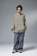 Utility Pocket Nylon Long-Sleeve Pullover in Trunk Brown - full-length front modeled view