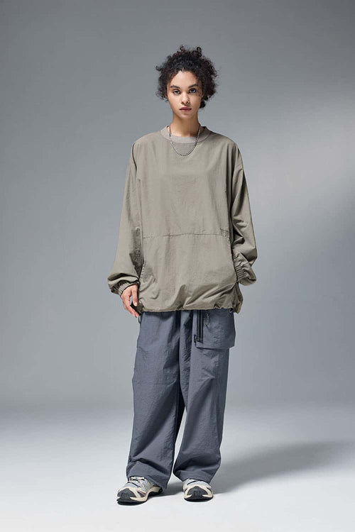 Utility Pocket Nylon Long-Sleeve Pullover in Trunk Brown - full-length front modeled view