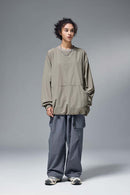 Utility Pocket Nylon Long-Sleeve Pullover in Trunk Brown - full-length front modeled view