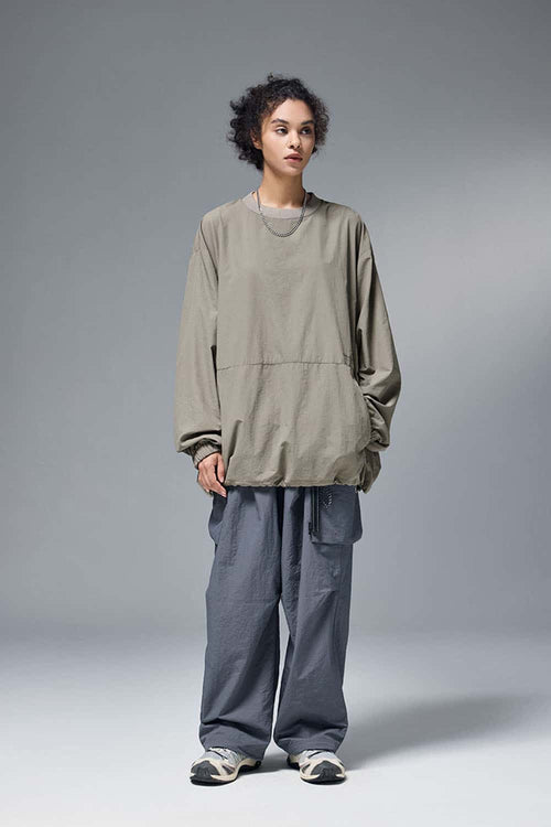 Utility Pocket Nylon Long-Sleeve Pullover in Trunk Brown - full-length front modeled view