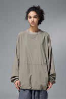 Utility Pocket Nylon Long-Sleeve Pullover in Trunk Brown - front modeled close-up