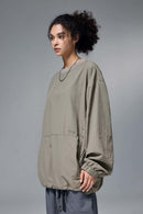 Utility Pocket Nylon Long-Sleeve Pullover in Trunk Brown - three-quarter front modeled view