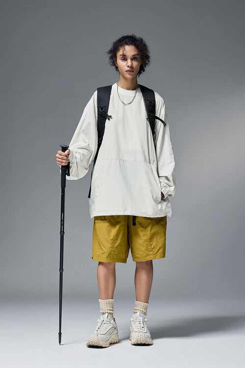Utility Pocket Nylon Long-Sleeve Pullover in White - full-length front modeled view