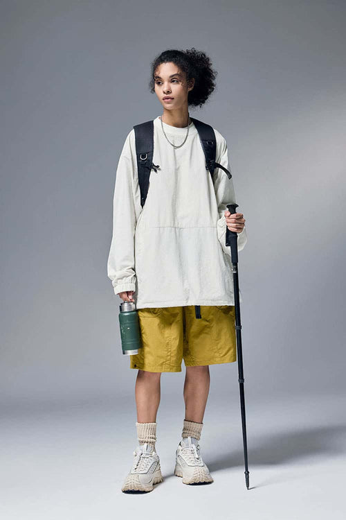 Utility Pocket Nylon Long-Sleeve Pullover in White - full-length front modeled view