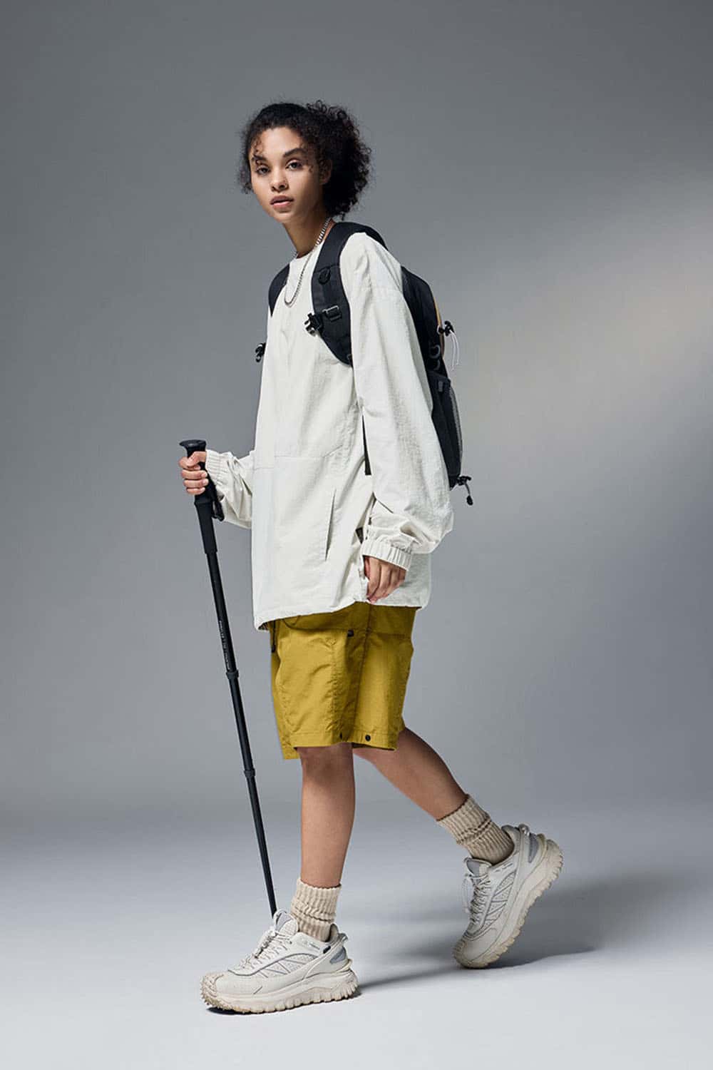 Utility Pocket Nylon Long-Sleeve Pullover in White - full-length front modeled view