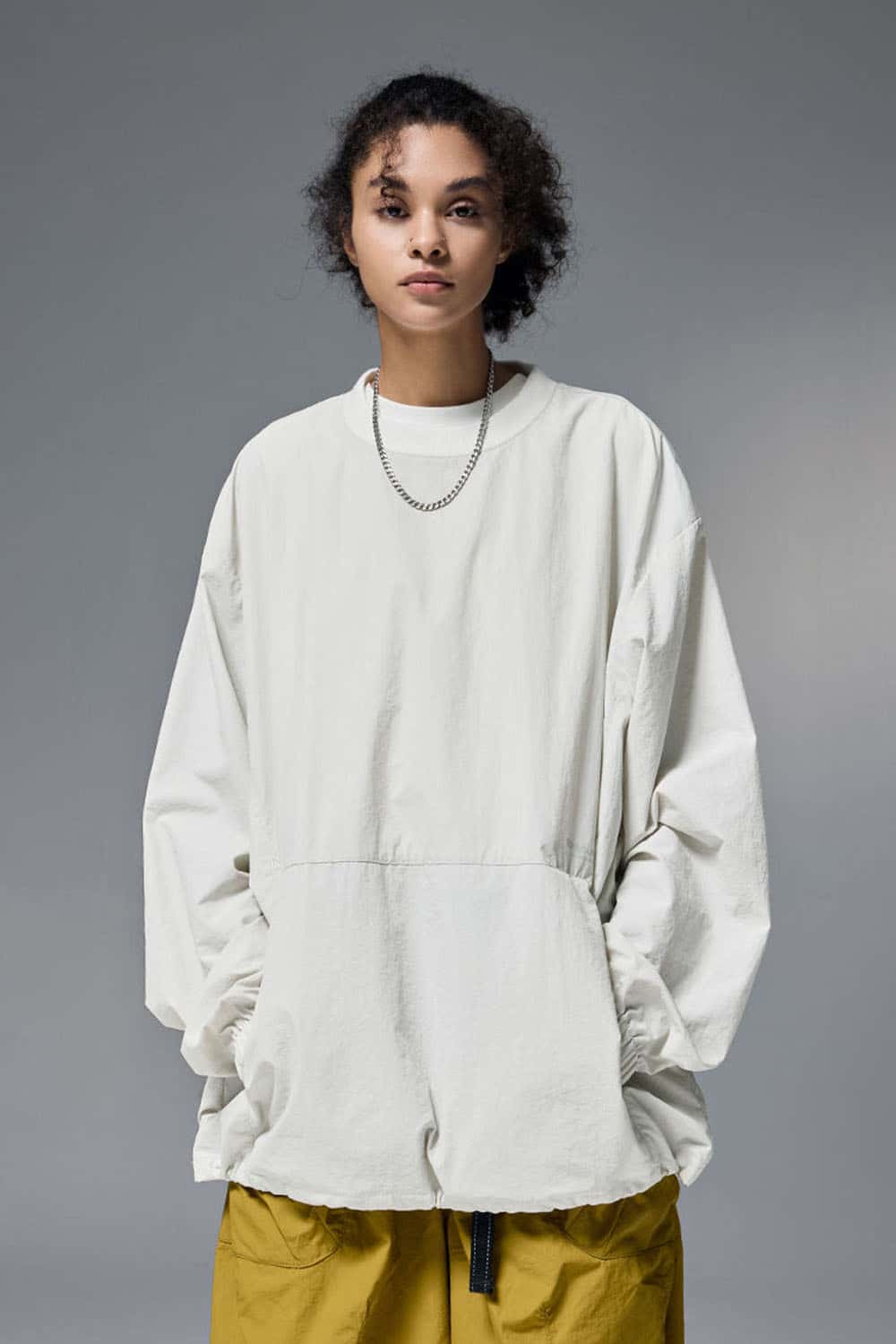 Utility Pocket Nylon Long-Sleeve Pullover in White - front modeled close-up