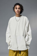 Utility Pocket Nylon Long-Sleeve Pullover in White - front modeled close-up
