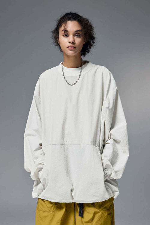 Utility Pocket Nylon Long-Sleeve Pullover in White - front modeled close-up