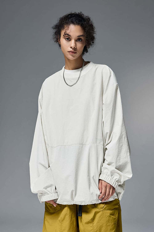 Utility Pocket Nylon Long-Sleeve Pullover in White - front modeled close-up