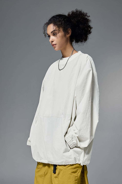Utility Pocket Nylon Long-Sleeve Pullover in White - three-quarter front modeled view
