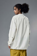 Utility Pocket Nylon Long-Sleeve Pullover in White - rear three-quarter modeled view