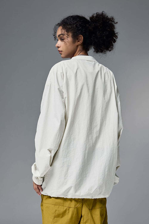 Utility Pocket Nylon Long-Sleeve Pullover in White - rear three-quarter modeled view