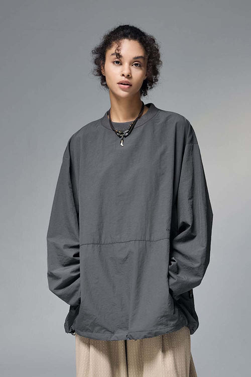 Utility Pocket Nylon Long-Sleeve Pullover in Wilderness Gray - front modeled close-up