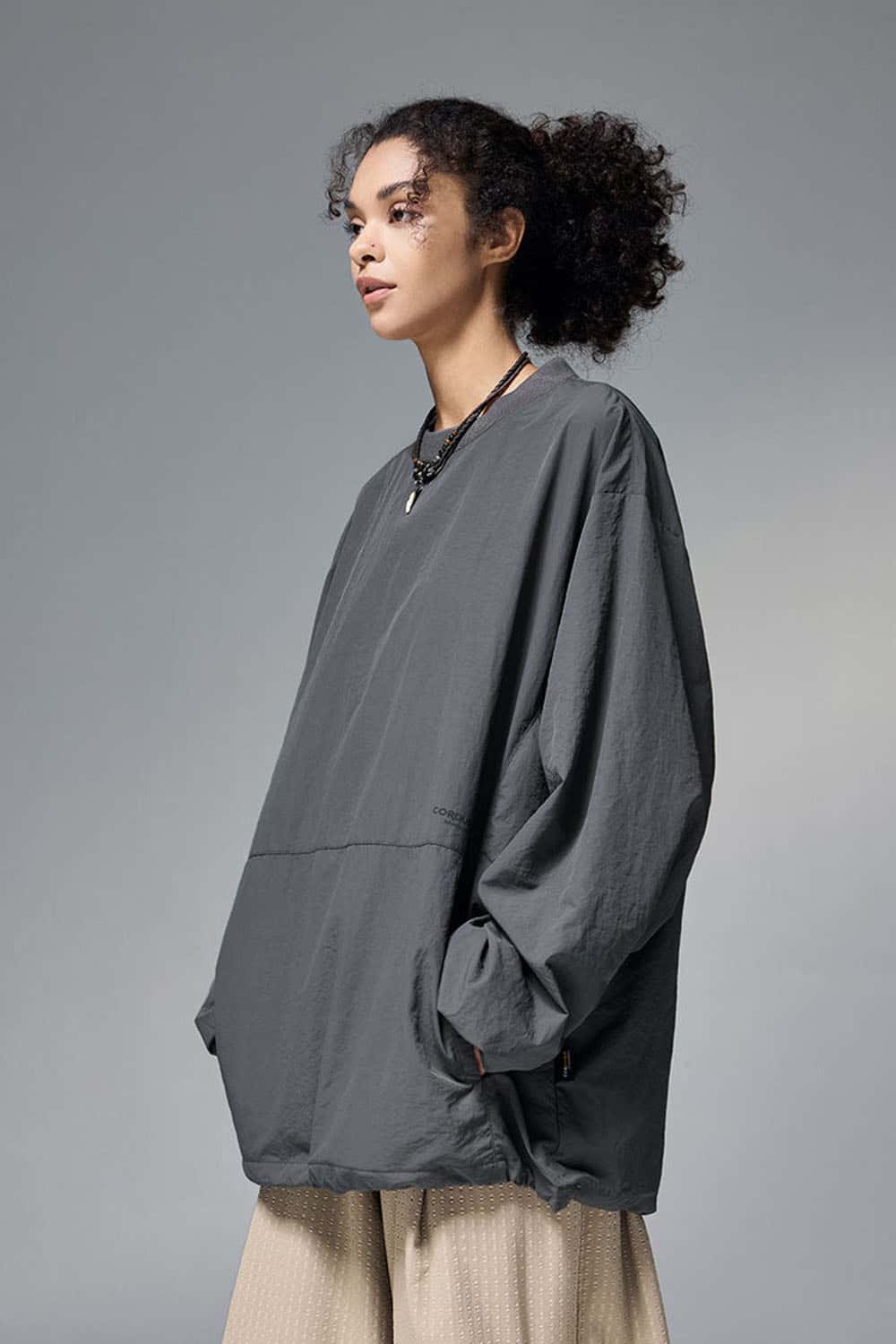 Utility Pocket Nylon Long-Sleeve Pullover in Wilderness Gray - three-quarter front modeled view