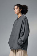 Utility Pocket Nylon Long-Sleeve Pullover in Wilderness Gray - three-quarter front modeled view