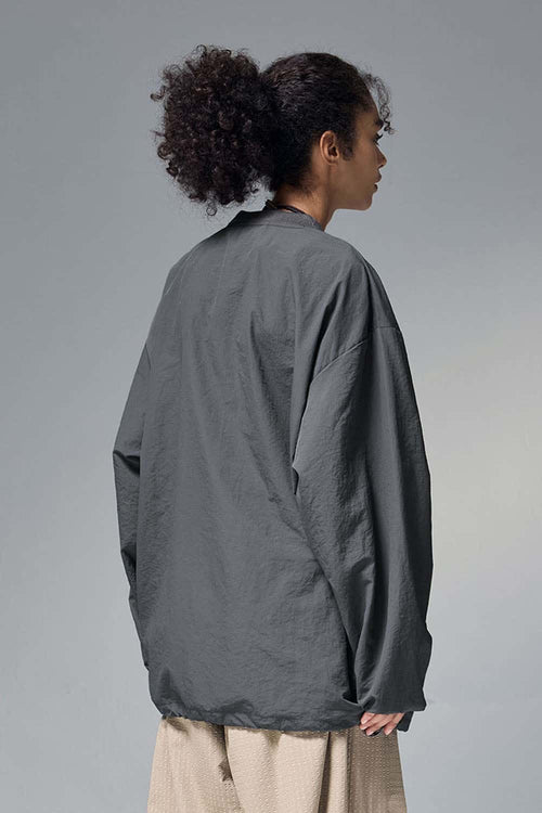 Utility Pocket Nylon Long-Sleeve Pullover in Wilderness Gray - rear three-quarter modeled view