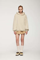Drop-Shoulder Rib-Trim Pullover Hoodie in Apricot - full-length front modeled view