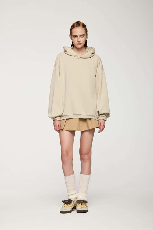 Drop-Shoulder Rib-Trim Pullover Hoodie in Apricot - full-length front modeled view