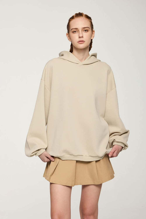 Drop-Shoulder Rib-Trim Pullover Hoodie in Apricot - front modeled view
