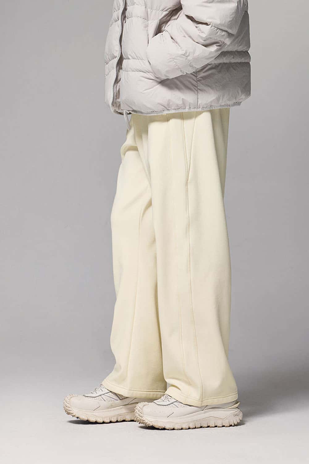 4-Way Stretch Thermal-Fleece Straight-Leg Sweatpants in White - three-quarter front modeled view