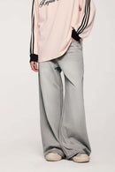Washed Five-Pocket Wide Straight-Leg Denim Pants in Light Gray - front modeled close-up