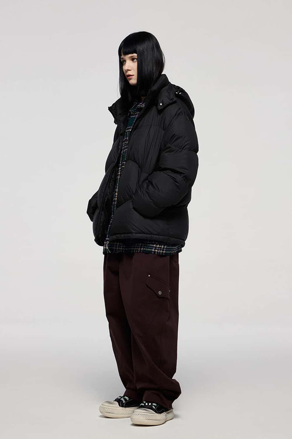 Packable White Duck Down Hooded Puffer Jacket in Black - full-length side modeled view