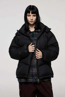 Packable White Duck Down Hooded Puffer Jacket in Black - front modeled close-up