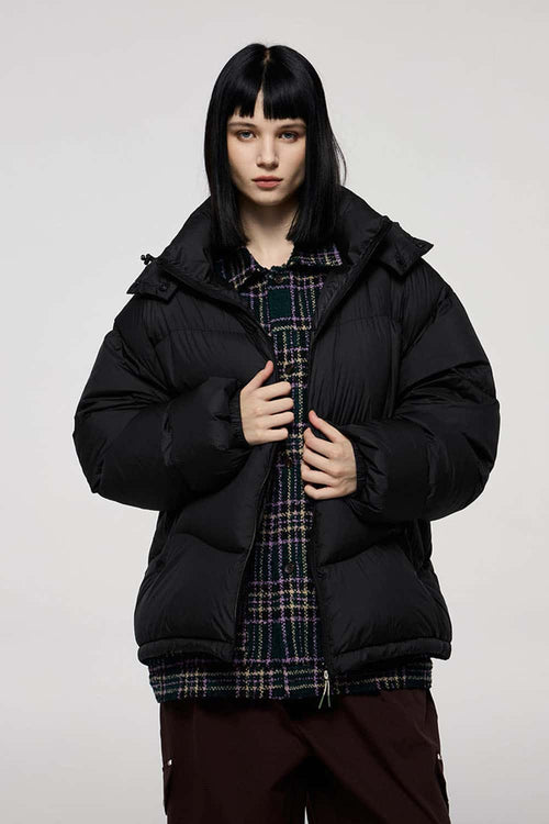 Packable White Duck Down Hooded Puffer Jacket in Black - front modeled close-up