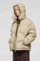 Packable White Duck Down Hooded Puffer Jacket in Khaki - three-quarter front modeled view