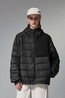 Waterproof White Duck Down Hooded Puffer Jacket in Black - front modeled close-up