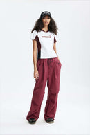 Graphic Color-Block Raglan-Sleeve Sporty T-Shirt in White - full-length front modeled view