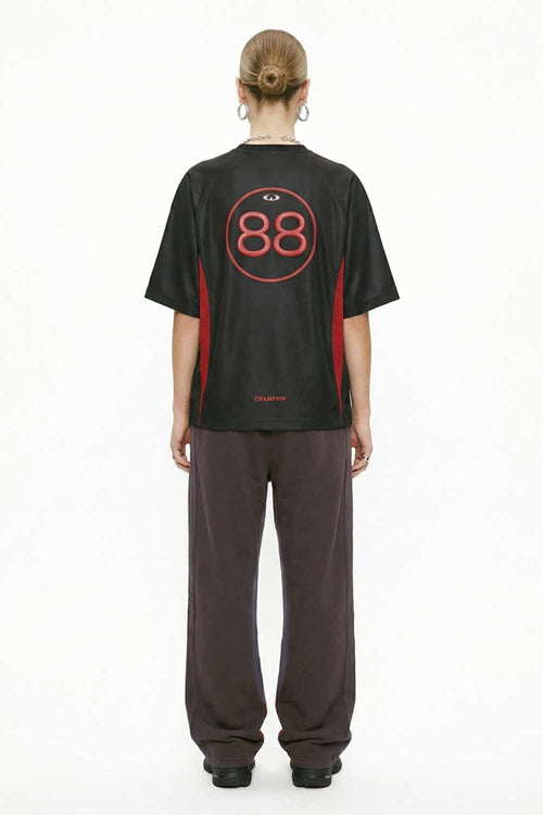 Mesh-Panel Graphic Raglan Tee in Black - full-length back modeled view