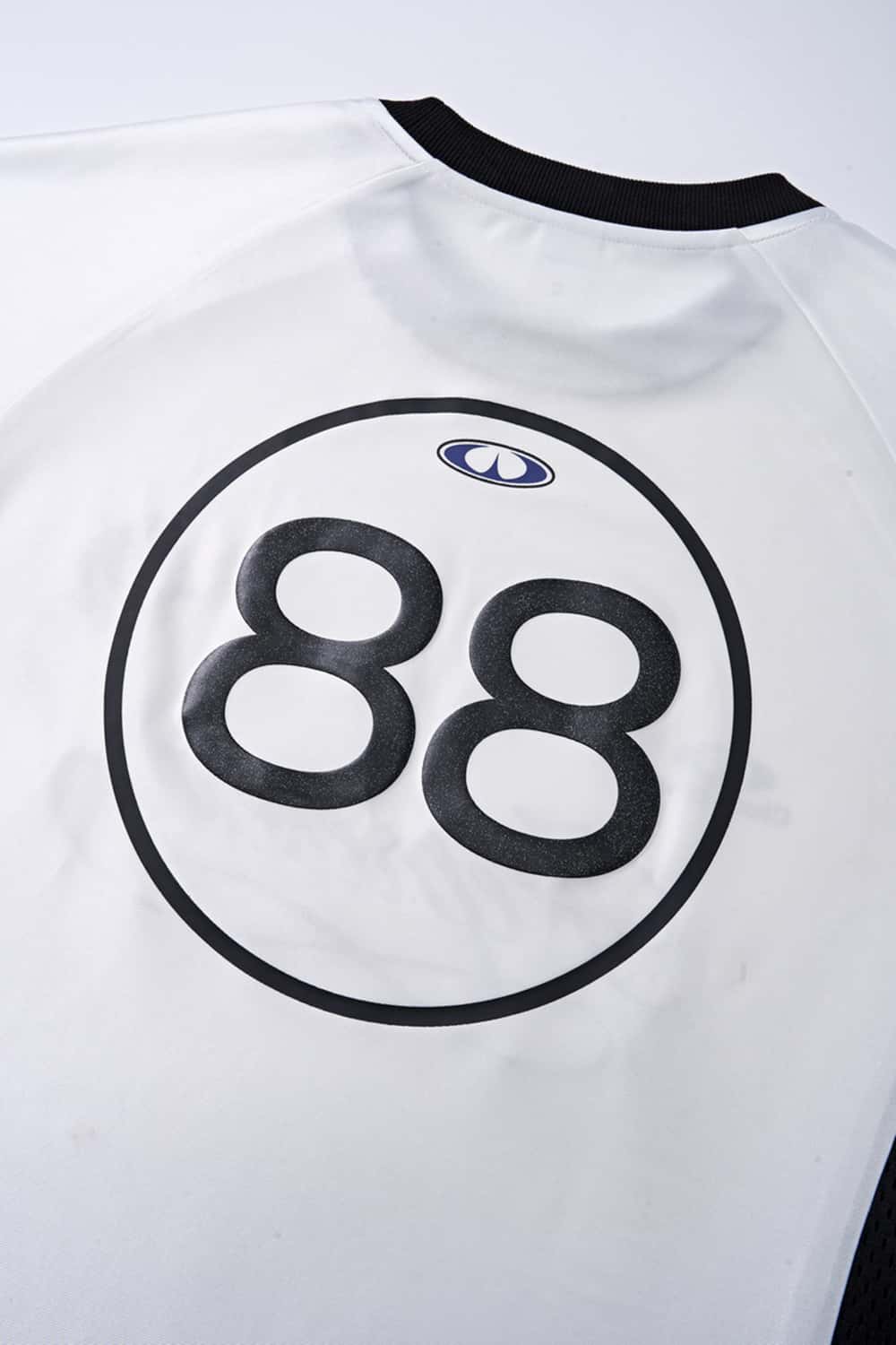 Mesh-Panel Graphic Raglan Tee in Off White - graphic detail