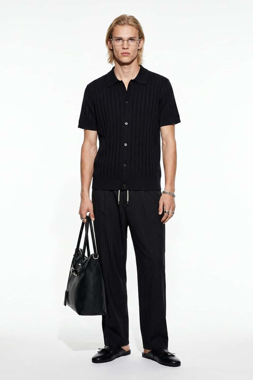 Button-Front Short-Sleeve Knit Shirt in Black - full-length front modeled view
