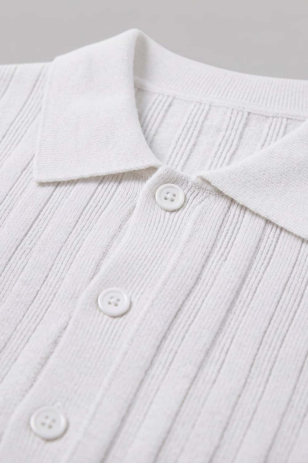 Button-Front Short-Sleeve Knit Shirt in White - collar and placket close-up