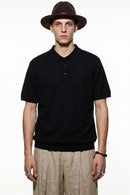 Relaxed Cotton Knit Polo Shirt in Black - front modeled view