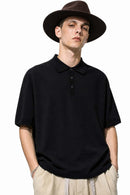 Relaxed Cotton Knit Polo Shirt in Black - front modeled view