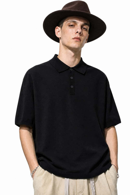 Relaxed Cotton Knit Polo Shirt in Black - front modeled view