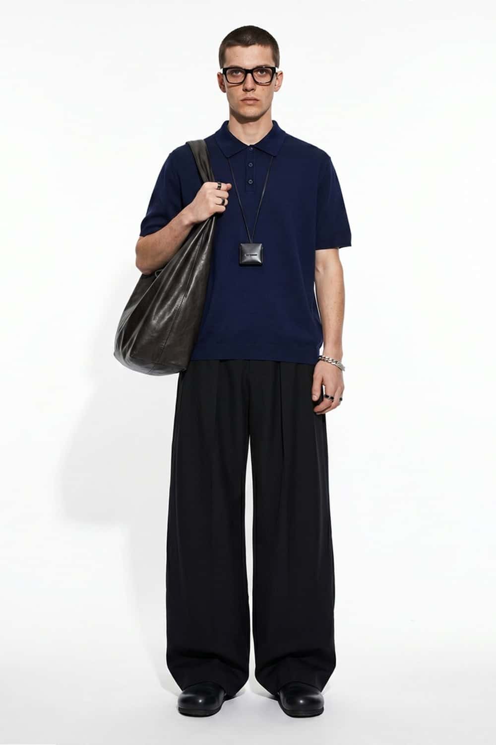 Relaxed Cotton Knit Polo Shirt in Navy Blue - full-length front modeled view