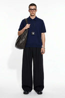 Relaxed Cotton Knit Polo Shirt in Navy Blue - full-length front modeled view
