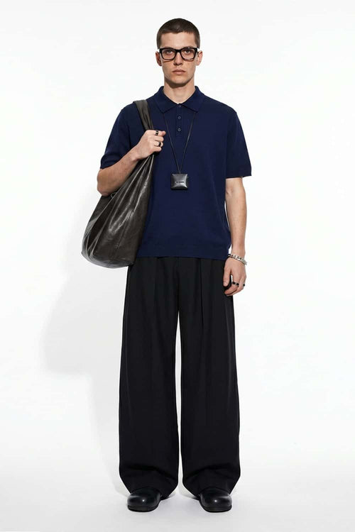Relaxed Cotton Knit Polo Shirt in Navy Blue - full-length front modeled view