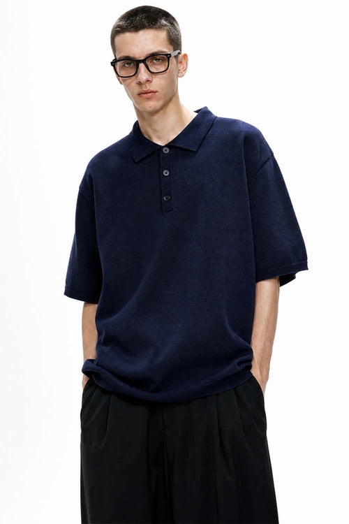 Relaxed Cotton Knit Polo Shirt in Navy Blue - full-length front modeled view