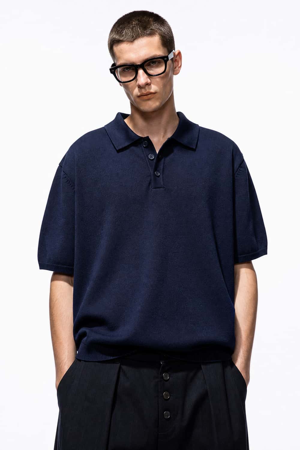 Relaxed Cotton Knit Polo Shirt in Navy Blue - front modeled view