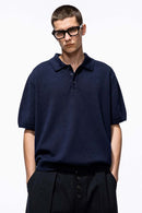 Relaxed Cotton Knit Polo Shirt in Navy Blue - front modeled view